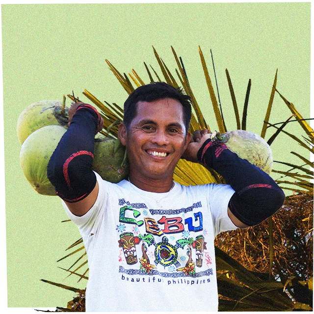 man-carrying-coconuts